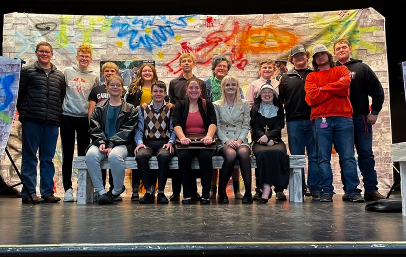 One Act cast and crew poses on stage