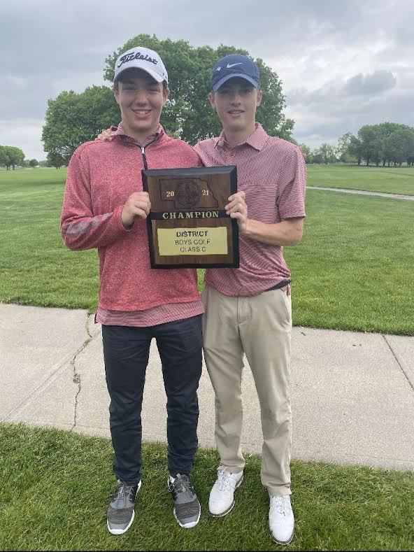 Andrea Stock and Ethan Smith hold a district championship trophy from last year.